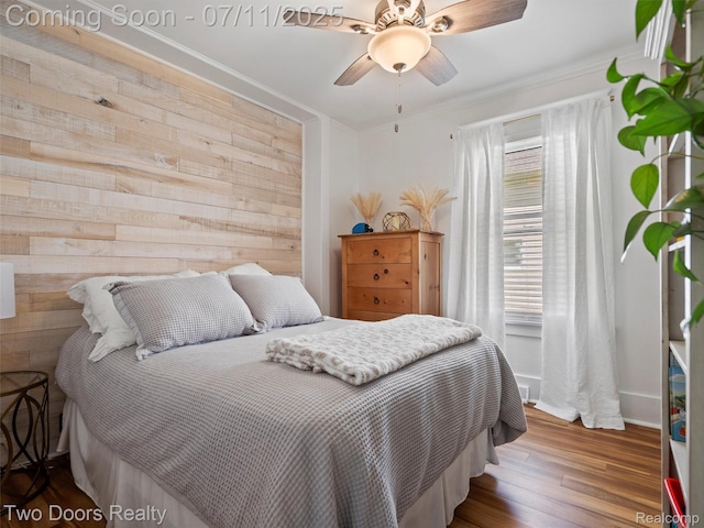 30 Beebe St, Lake Orion, MI 48362 - bedroom featuring wooden walls, ornamental molding, wood finished floors, and ceiling fan