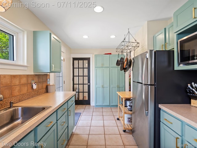 30 Beebe St, Lake Orion, MI 48362 - kitchen featuring freestanding refrigerator, light countertops, decorative backsplash, light tile patterned flooring, and recessed lighting