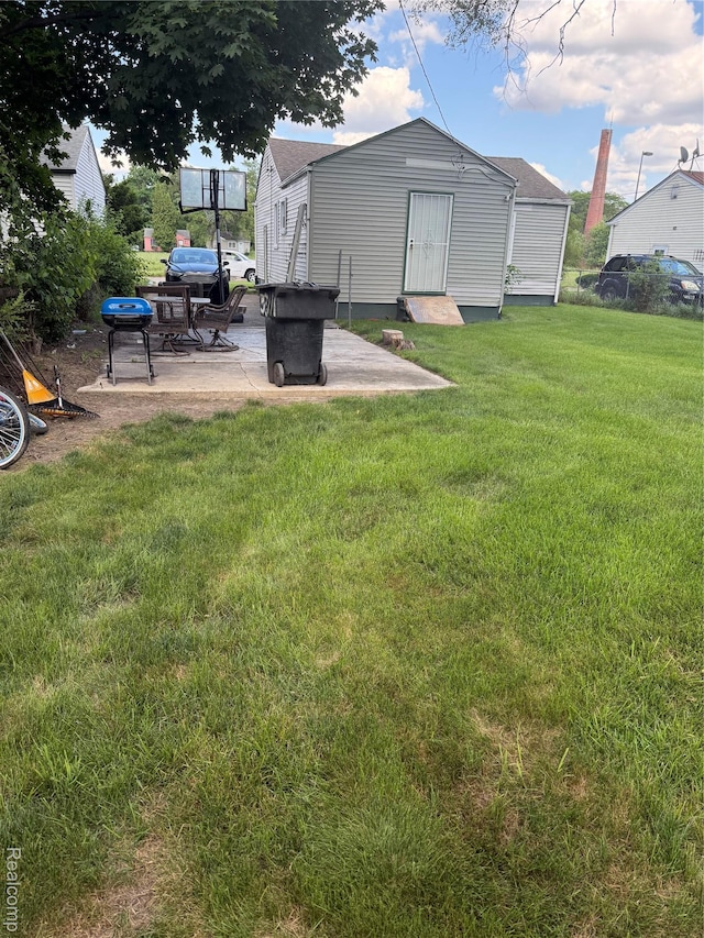 19361 Lindsay St, Detroit, MI 48235 - view of green lawn featuring a patio