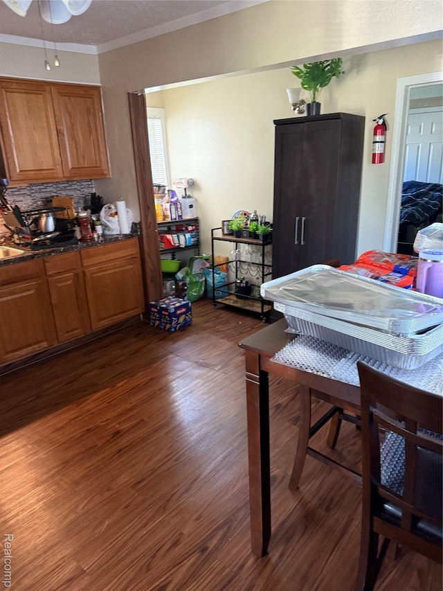 19361 Lindsay St, Detroit, MI 48235 - dining area featuring ornamental molding, dark wood-style floors, and a ceiling fan