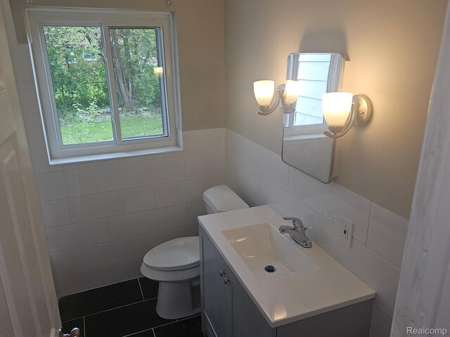 23091 Sussex St, Oak Park, MI 48237 - half bath with tile walls, vanity, and a wainscoted wall