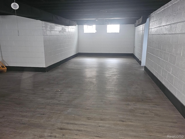 23091 Sussex St, Oak Park, MI 48237 - below grade area with concrete block wall and dark wood-style flooring