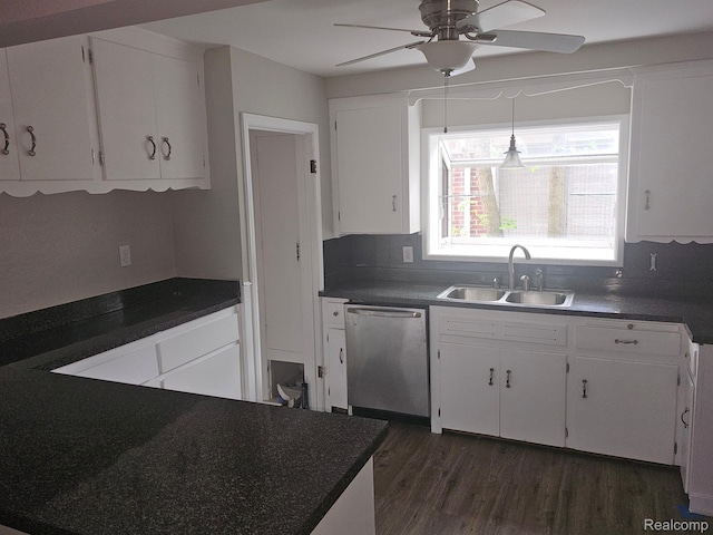 23091 Sussex St, Oak Park, MI 48237 - kitchen featuring stainless steel dishwasher, dark countertops, dark wood-type flooring, a ceiling fan, and white cabinetry