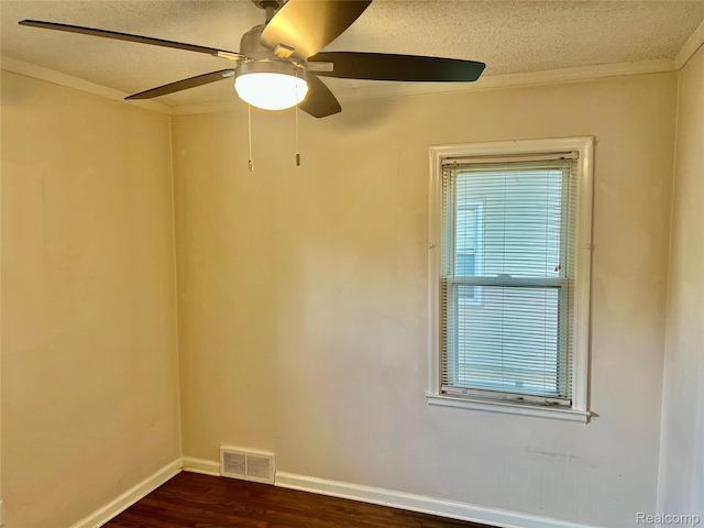 1992 Griffith Ave, Berkley, MI 48072 - spare room with dark wood-type flooring, ceiling fan, a textured ceiling, healthy amount of natural light, and ornamental molding