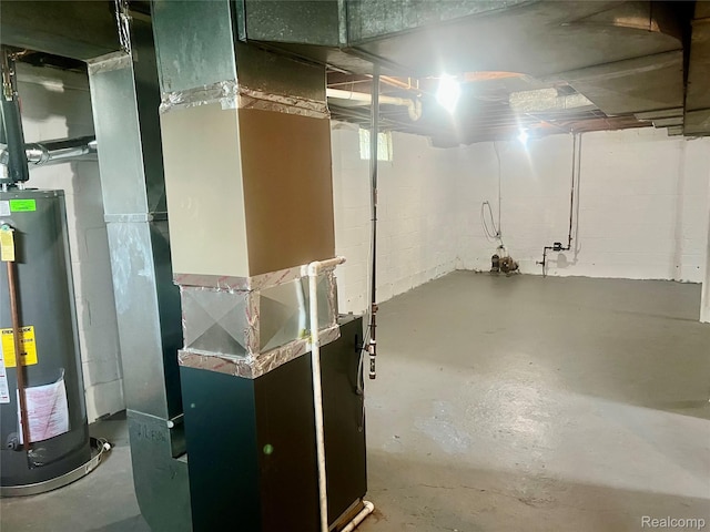 1992 Griffith Ave, Berkley, MI 48072 - unfinished below grade area with gas water heater, heating unit, and concrete block wall