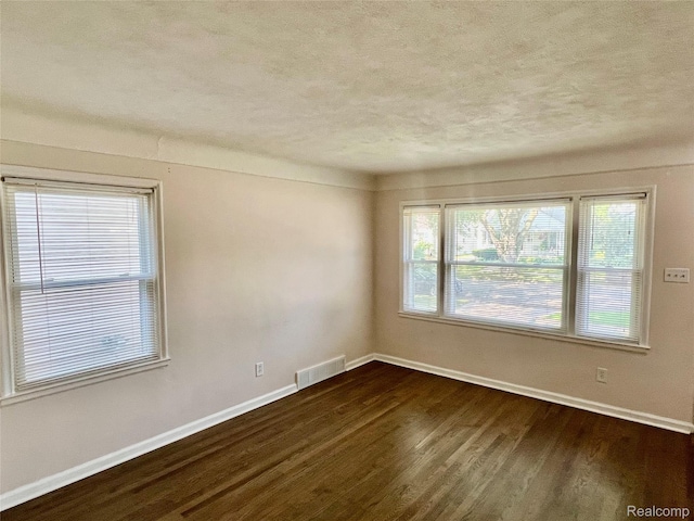 1992 Griffith Ave, Berkley, MI 48072 - spare room featuring a textured ceiling and dark wood-type flooring