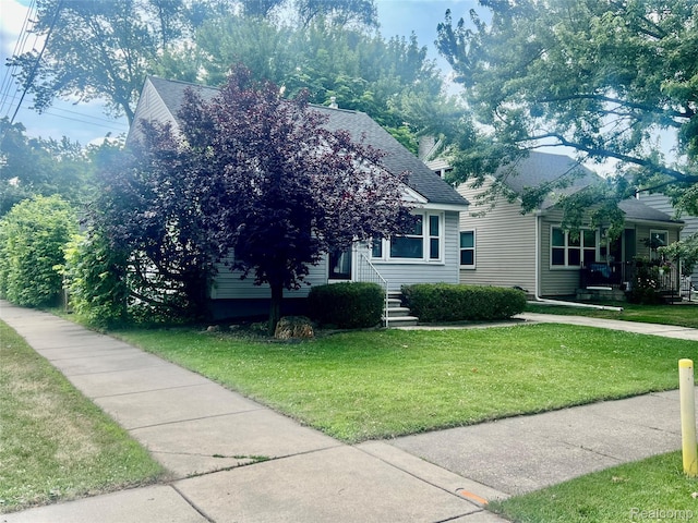 1992 Griffith Ave, Berkley, MI 48072 - view of property hidden behind natural elements with a front lawn and a shingled roof