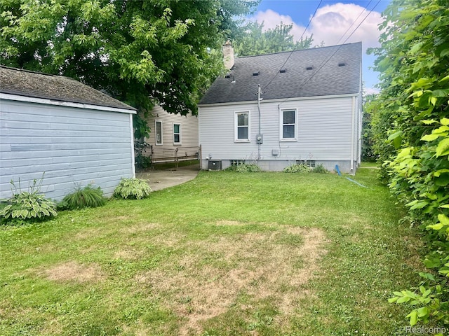 1992 Griffith Ave, Berkley, MI 48072 - back of property with a chimney, a lawn, and a patio