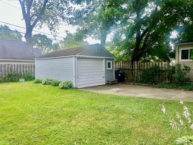 1992 Griffith Ave, Berkley, MI 48072 - view of yard featuring a garage, an outdoor structure, and driveway