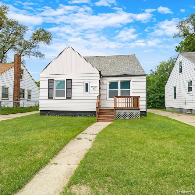 19943 Southfield Fwy, Detroit, MI 48235 - bungalow-style house featuring a shingled roof, a wooden deck, and board and batten siding