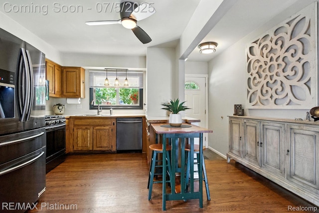 11634 Spicer Dr, Plymouth, MI 48170 - kitchen featuring fridge with ice dispenser, stainless steel dishwasher, gas range oven, a ceiling fan, and dark wood finished floors