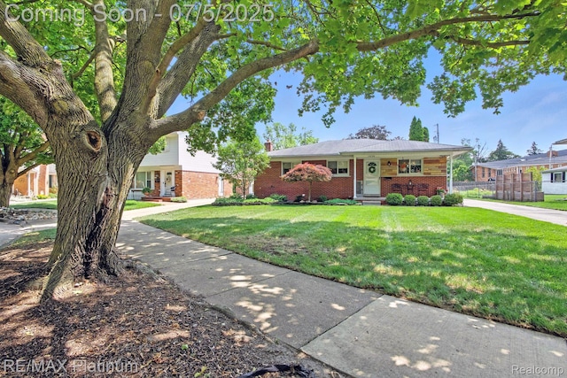 11634 Spicer Dr, Plymouth, MI 48170 - view of front of property with brick siding and a front yard