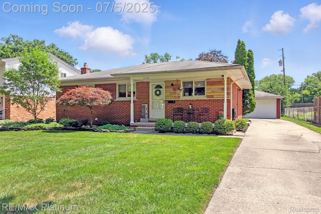 11634 Spicer Dr, Plymouth, MI 48170 - view of front of home with brick siding and a detached garage