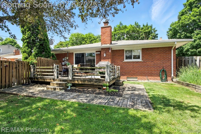 11634 Spicer Dr, Plymouth, MI 48170 - back of property featuring a wooden deck, a fenced backyard, brick siding, and a chimney