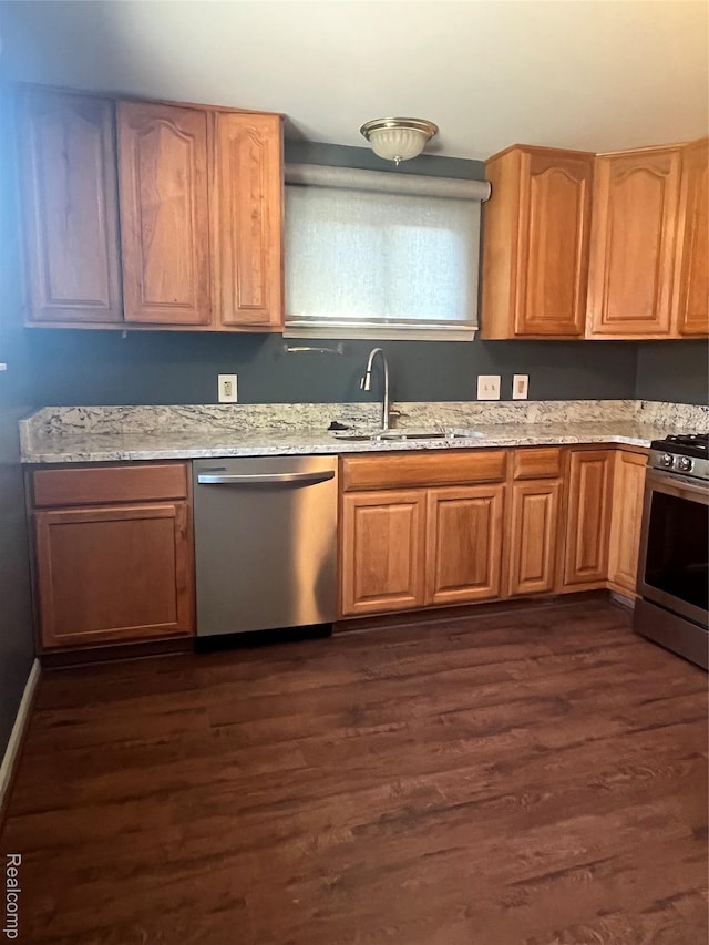 808 Lamay Ave, Ypsilanti, MI 48198 - kitchen with stainless steel appliances, light stone counters, and dark wood-style floors