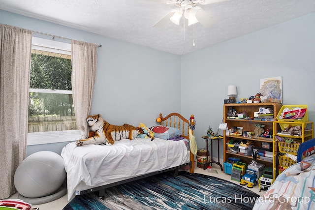 1003 Kusterer Dr NW, Grand Rapids, MI 49534 - bedroom featuring carpet, ceiling fan, and a textured ceiling