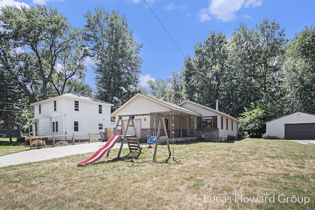 1003 Kusterer Dr NW, Grand Rapids, MI 49534 - view of front of property featuring a playground and a front lawn