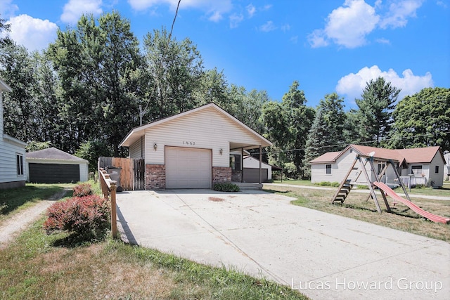 1003 Kusterer Dr NW, Grand Rapids, MI 49534 - view of side of property featuring brick siding and concrete driveway