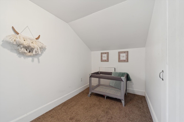334 N Hickory St, Owosso, MI 48867 - carpeted bedroom featuring vaulted ceiling and baseboards