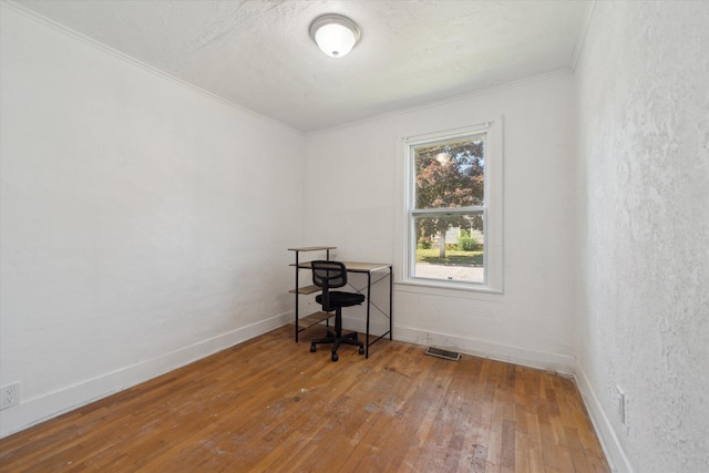 334 N Hickory St, Owosso, MI 48867 - office space featuring crown molding and hardwood / wood-style floors