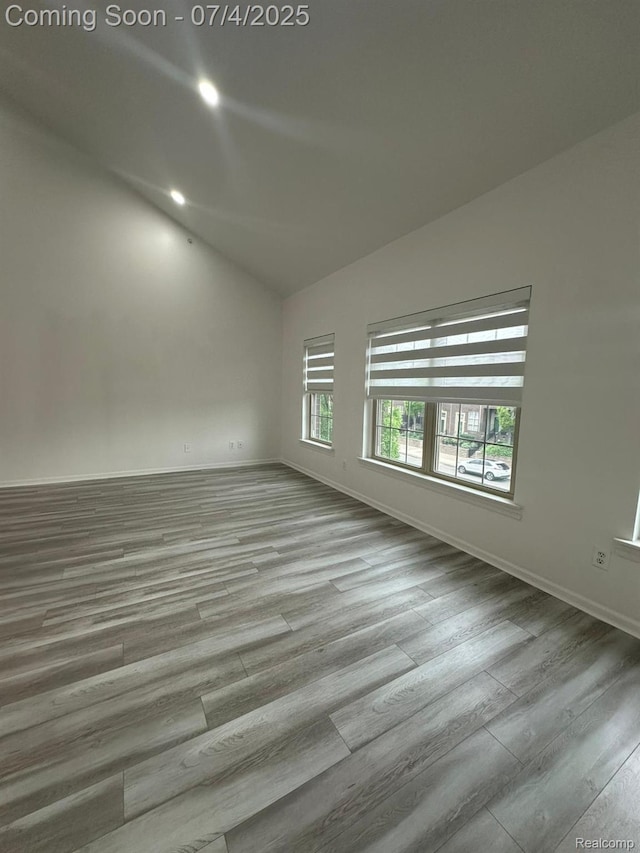 4248 Schaefer Rd, Dearborn, MI 48126 - empty room with lofted ceiling, wood finished floors, and recessed lighting