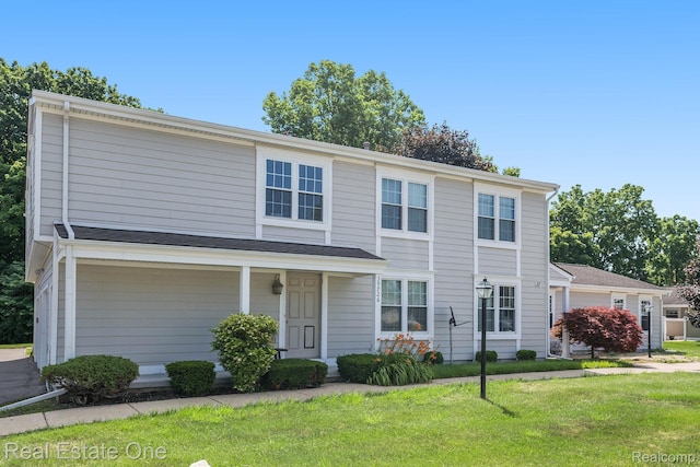 39728 Village Wood Cir, Novi, MI 48375 - traditional-style house with a front yard and covered porch