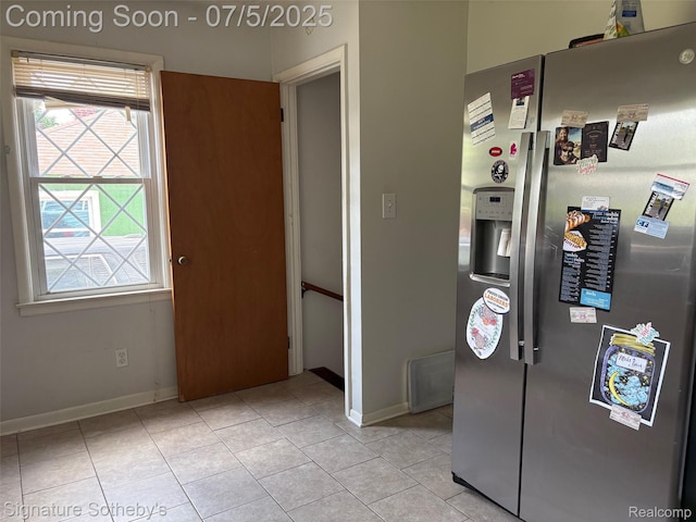 686 E Columbia Ave, Pontiac, MI 48340 - kitchen with stainless steel fridge and light tile patterned flooring