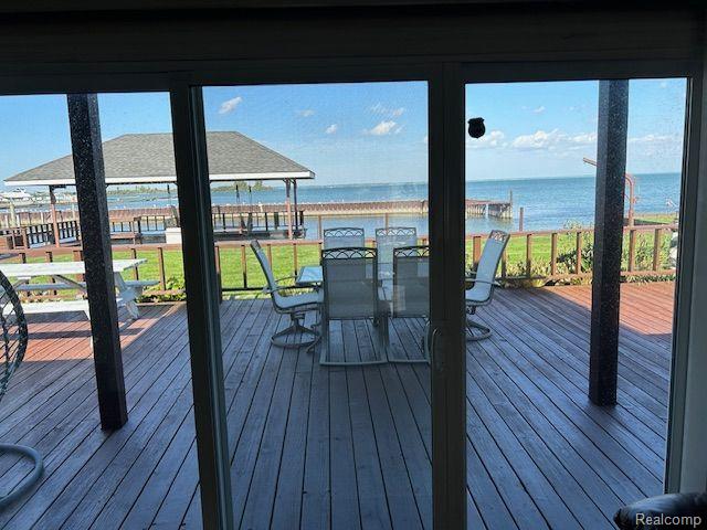32241 N River Rd, Harrison Township, MI 48045 - wooden terrace with a water view, outdoor dining space, and a gazebo