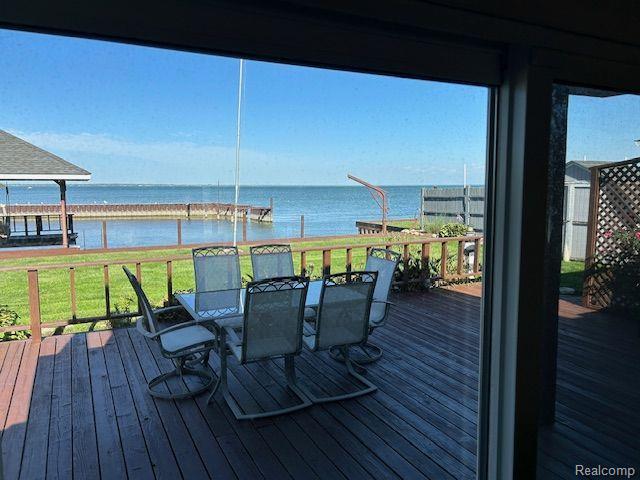 32241 N River Rd, Harrison Township, MI 48045 - wooden terrace featuring a water view and outdoor dining area