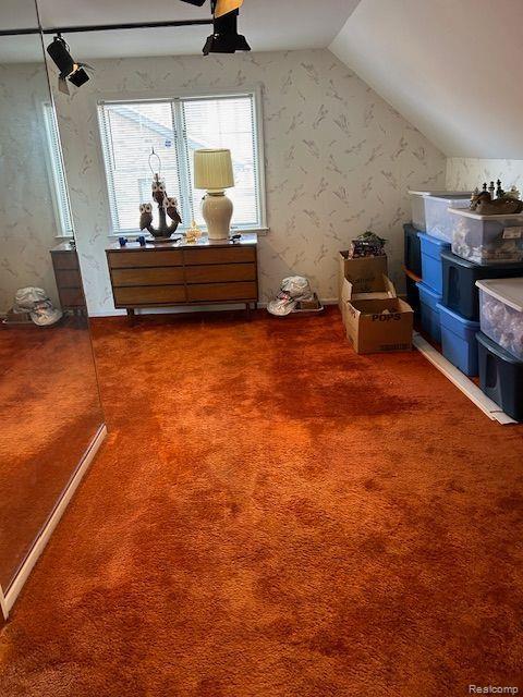 32241 N River Rd, Harrison Township, MI 48045 - additional living space featuring lofted ceiling, wallpapered walls, carpet, and a ceiling fan