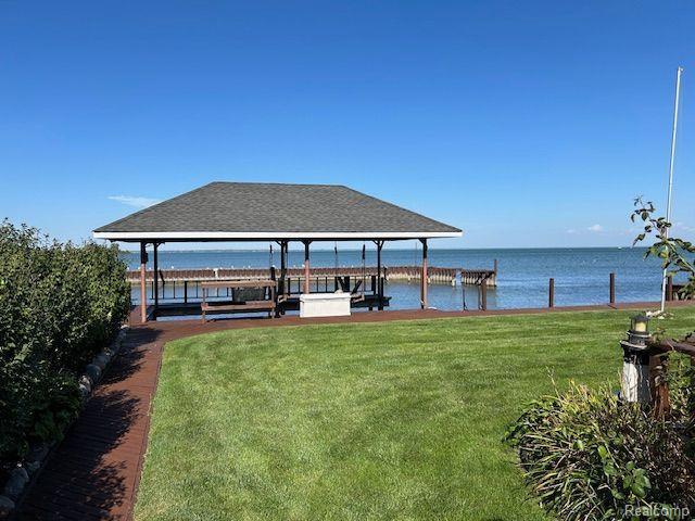 32241 N River Rd, Harrison Township, MI 48045 - dock area featuring a lawn, a water view, and boat lift