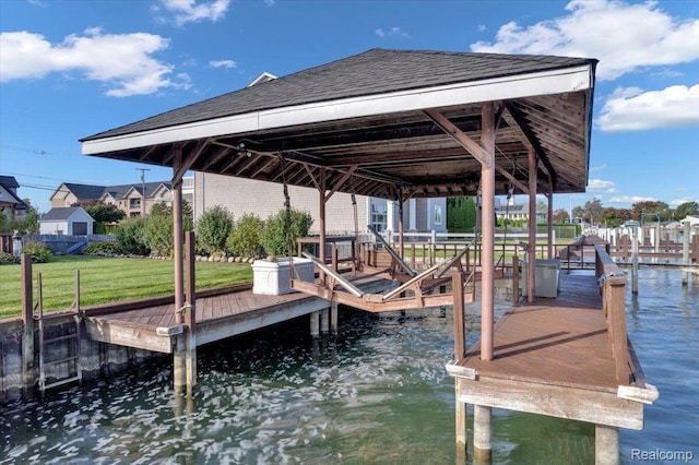 32241 N River Rd, Harrison Township, MI 48045 - dock featuring a water view, boat lift, and a lawn