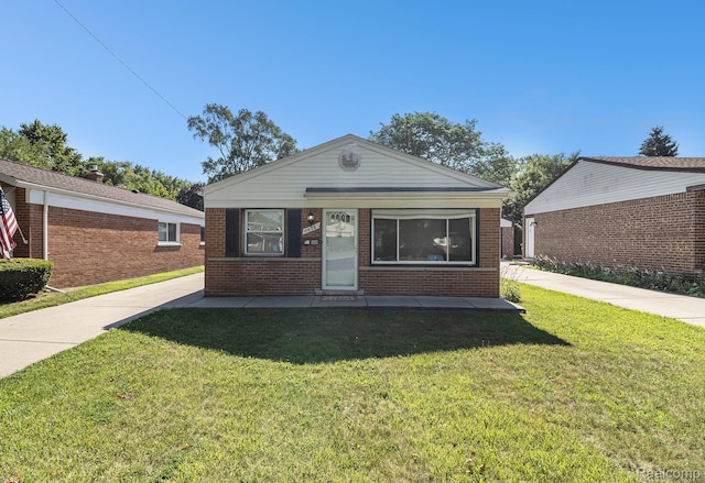 8476 Robindale Ave, Dearborn Heights, MI 48127 - view of front of property featuring brick siding and a front yard