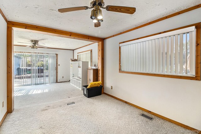 8476 Robindale Ave, Dearborn Heights, MI 48127 - empty room with a ceiling fan, carpet, a textured ceiling, and beam ceiling