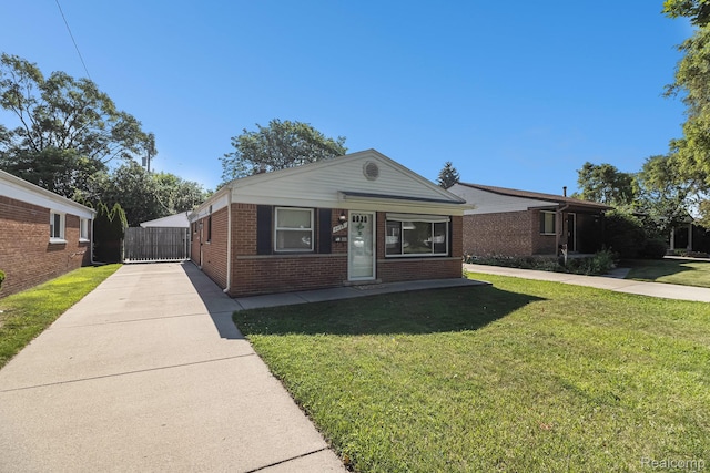 8476 Robindale Ave, Dearborn Heights, MI 48127 - view of front facade with brick siding, concrete driveway, and a front lawn