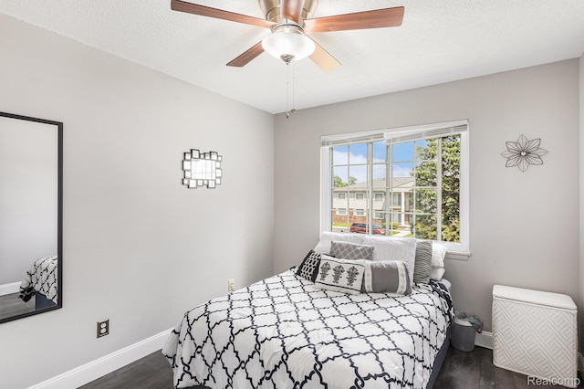 8150 24 Mile Rd, Shelby Twp, MI 48316 - bedroom with wood finished floors, a textured ceiling, and a ceiling fan