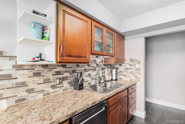 8150 24 Mile Rd, Shelby Twp, MI 48316 - kitchen featuring dishwashing machine, a textured ceiling, brown cabinetry, backsplash, and glass insert cabinets