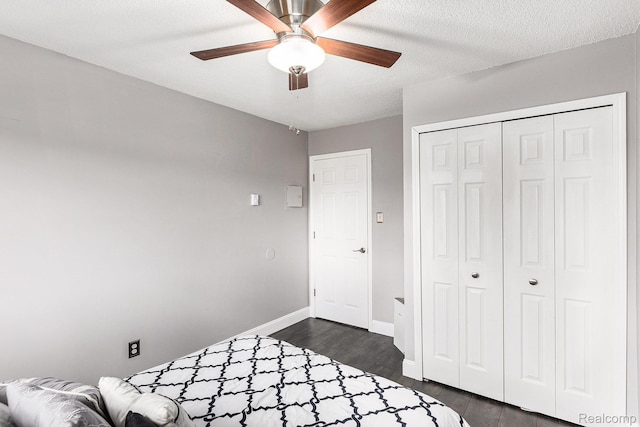 8150 24 Mile Rd, Shelby Twp, MI 48316 - bedroom with a closet, dark wood finished floors, and a ceiling fan