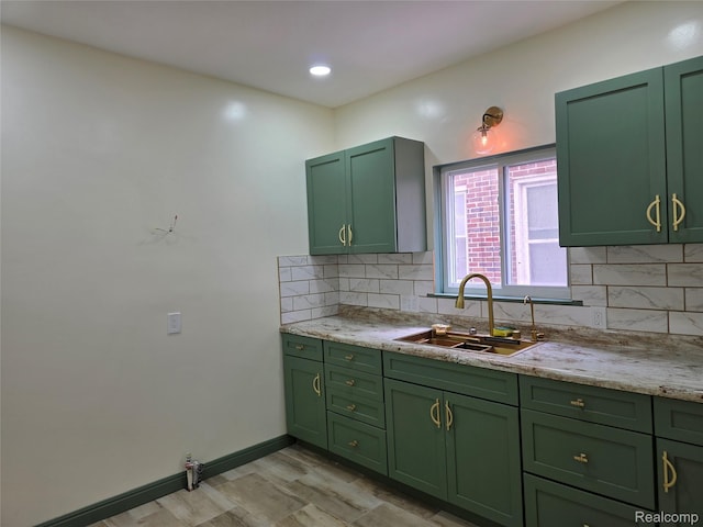 2681 Burlingame St, Detroit, MI 48206 - kitchen with green cabinetry, decorative backsplash, and light stone counters