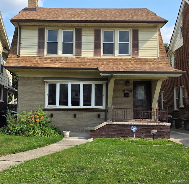 2681 Burlingame St, Detroit, MI 48206 - view of front of property with a chimney, brick siding, a front lawn, and a shingled roof