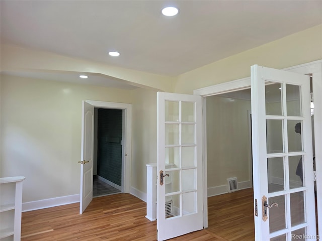 2681 Burlingame St, Detroit, MI 48206 - spare room with light wood-type flooring, recessed lighting, and french doors