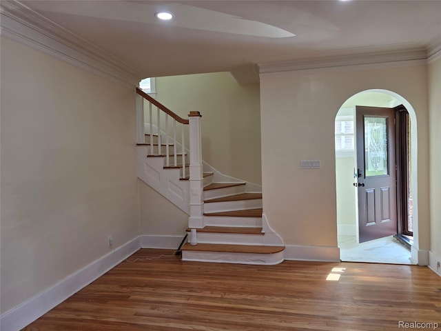 2681 Burlingame St, Detroit, MI 48206 - entryway with crown molding, arched walkways, wood finished floors, stairway, and recessed lighting