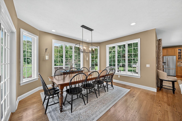 29750 Edwards Way, Niles, MI 49120 - dining space with light wood finished floors, plenty of natural light, a chandelier, and recessed lighting