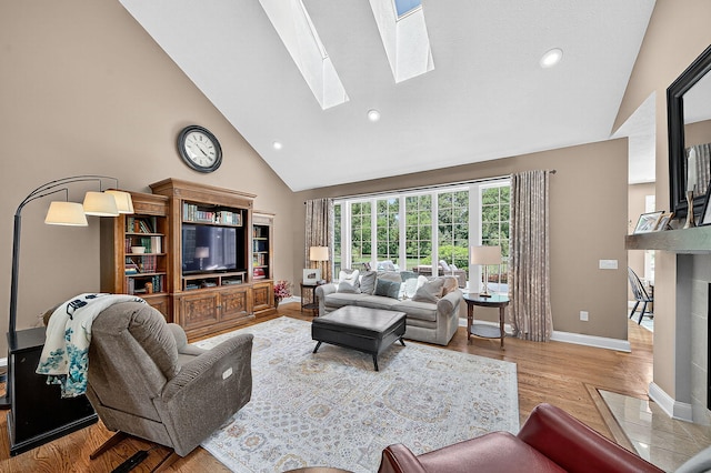 29750 Edwards Way, Niles, MI 49120 - living area featuring high vaulted ceiling, wood finished floors, a skylight, and recessed lighting