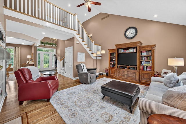 29750 Edwards Way, Niles, MI 49120 - living room featuring wood finished floors, high vaulted ceiling, stairway, ceiling fan, and recessed lighting