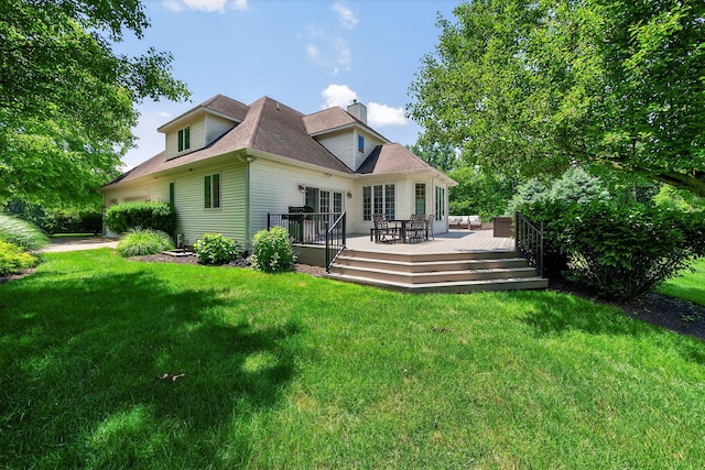 29750 Edwards Way, Niles, MI 49120 - back of property featuring a chimney, a lawn, and a deck