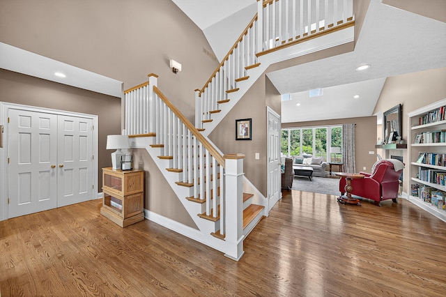 29750 Edwards Way, Niles, MI 49120 - stairs featuring wood finished floors, high vaulted ceiling, and recessed lighting