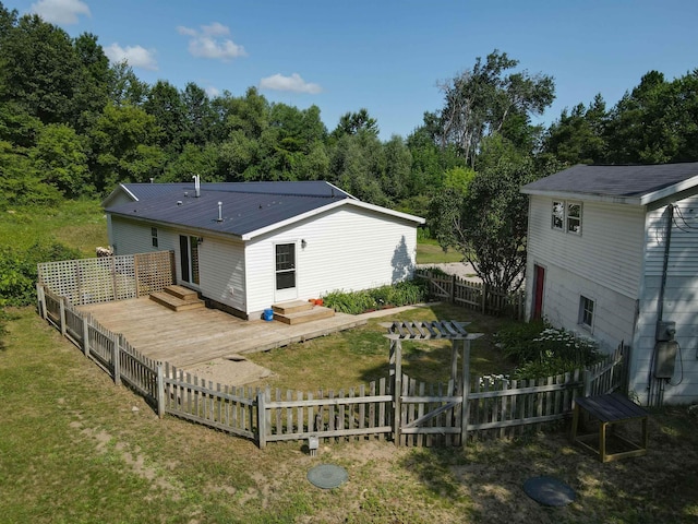 457 N Garfield, Traverse City, MI 49696 - rear view of house featuring a metal roof, a wooden deck, and entry steps
