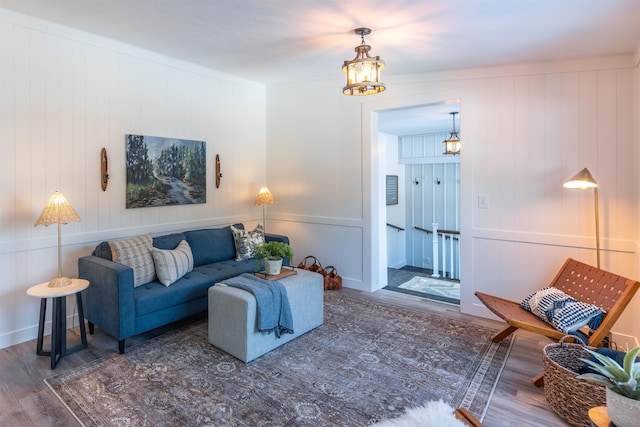 457 N Garfield, Traverse City, MI 49696 - living area featuring wood finished floors, a chandelier, and a decorative wall