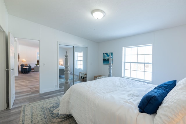 457 N Garfield, Traverse City, MI 49696 - bedroom with wood finished floors, lofted ceiling, and a closet